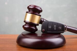 gavel and car key