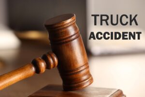 A judge's gavel rests prominently on a wooden table, symbolizing legal proceedings. In the background, subtle elements like a scale of justice or a blurred image of a truck suggest the context of truck accident law. The composition conveys the concept of legal accountability and justice in cases involving truck accidents.